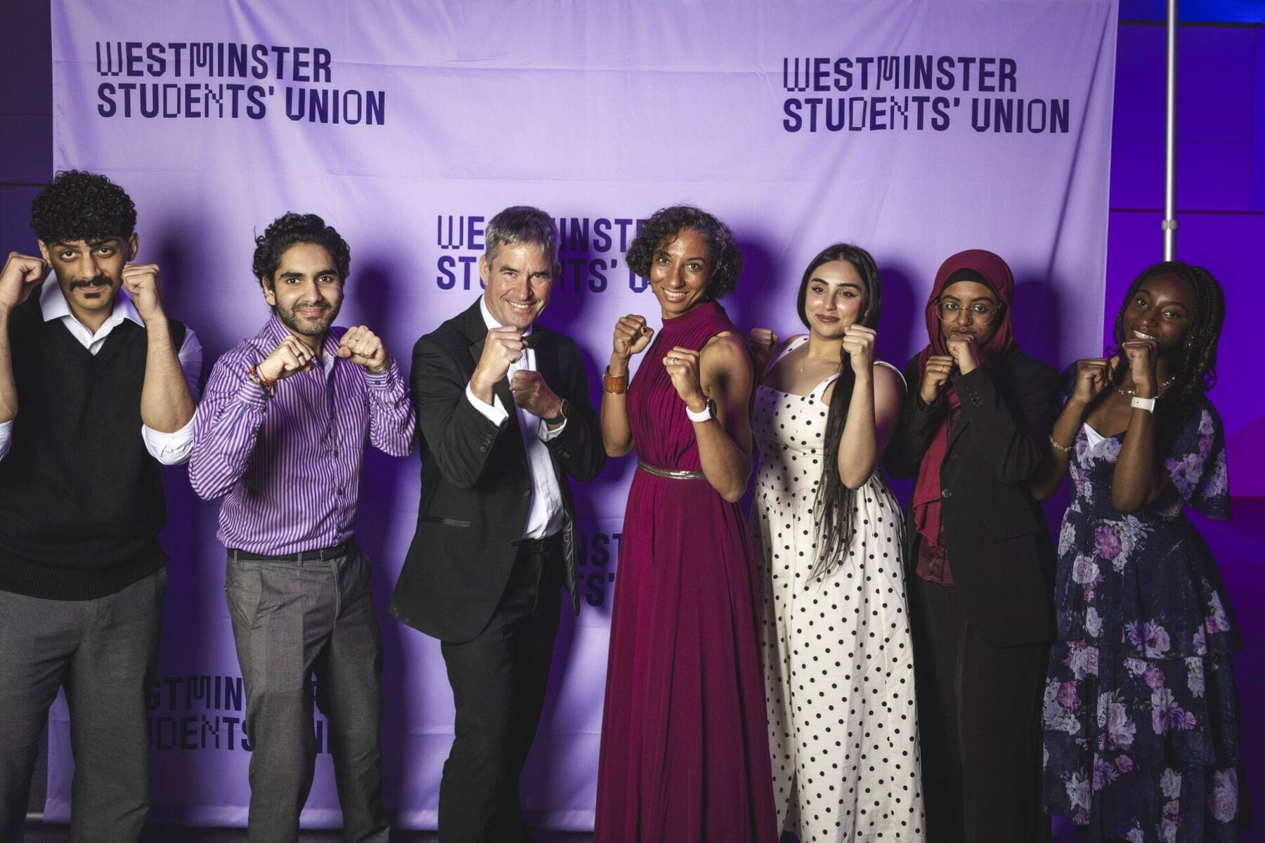 Karate Club committee at UWSU Awards Night with fighting stance