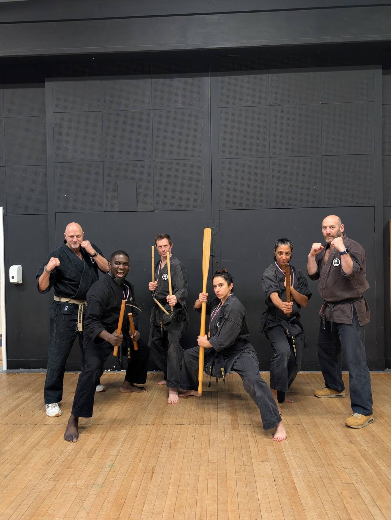 Weapons group in black gi