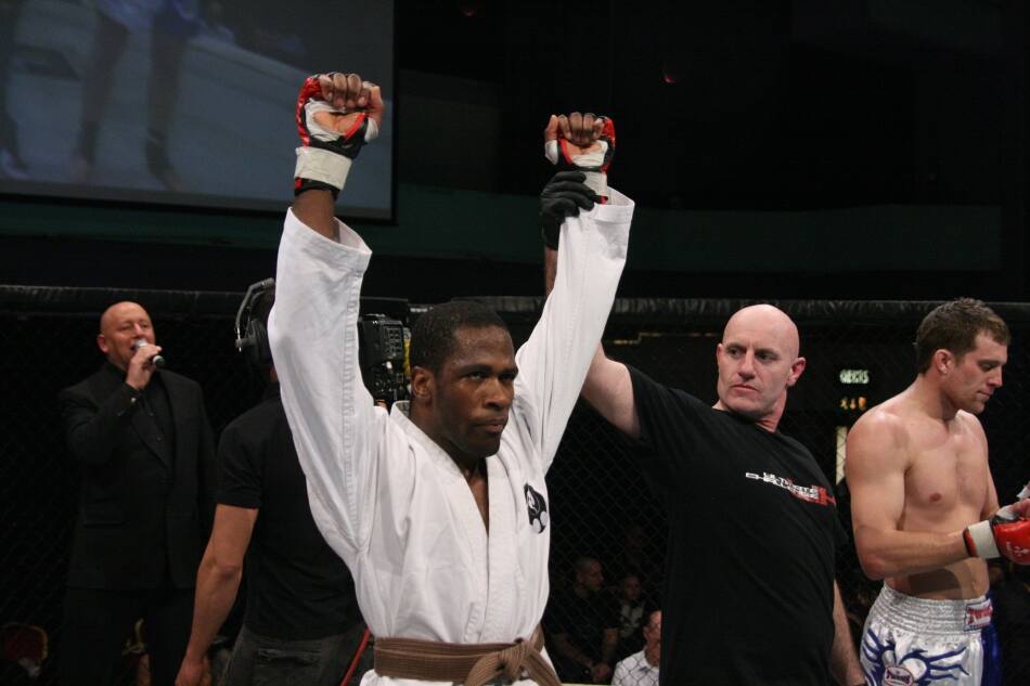 Edge hand raised in victory