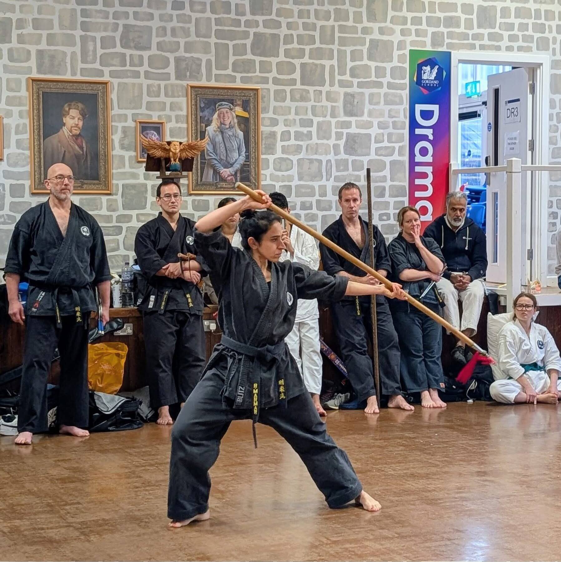 Woman performing bo staff kata