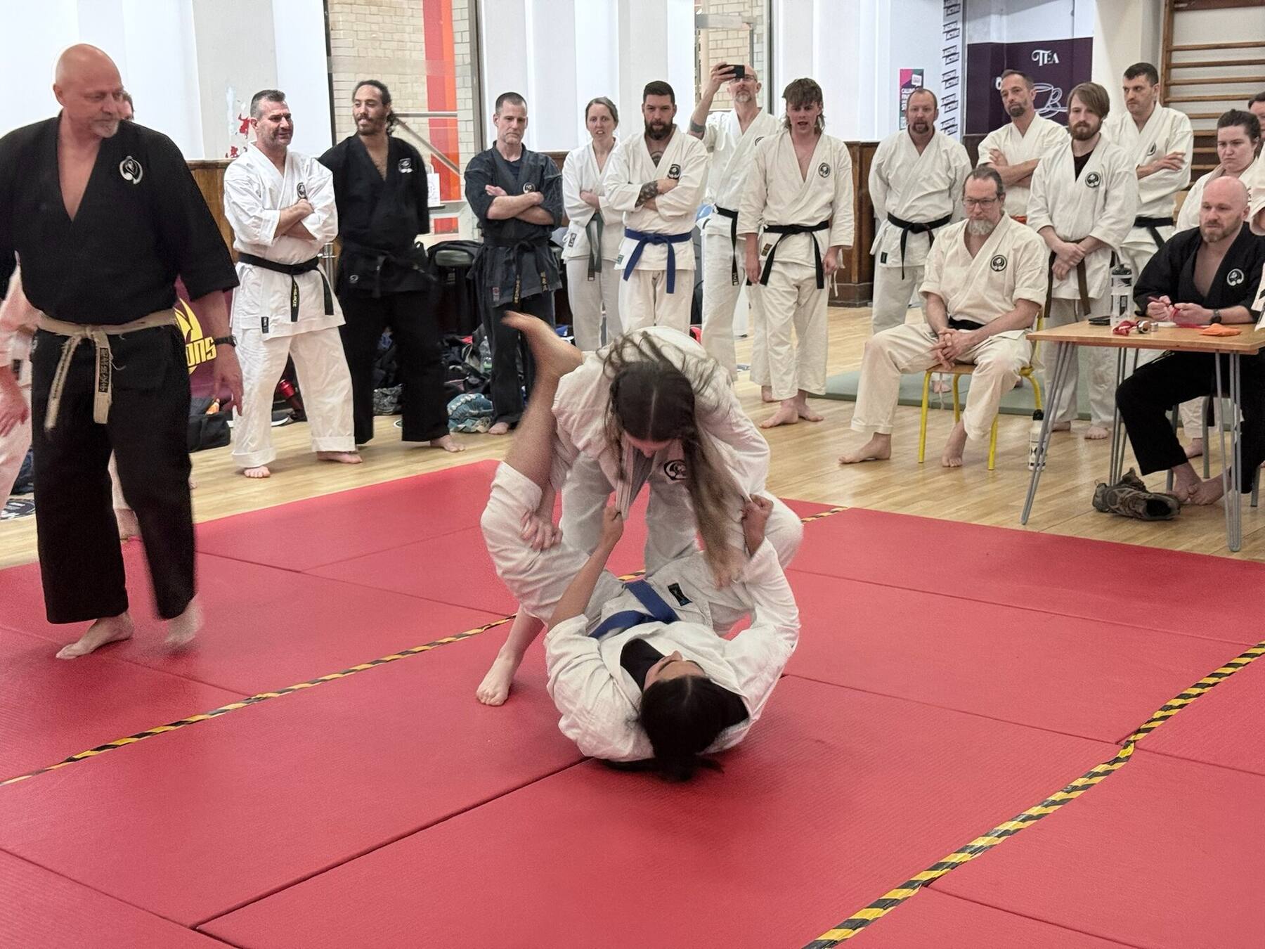 Grappling takedown with referee