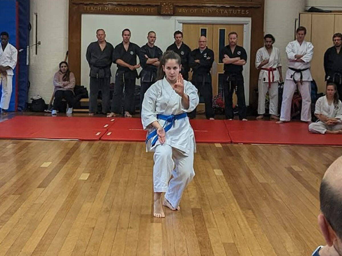 Carlotta performing kata as a coloured belt in front of the club
