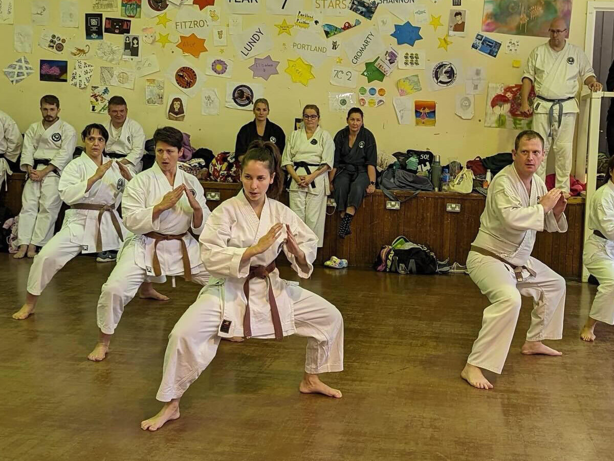 Carlotta front and centre performing kata alongside four club mates