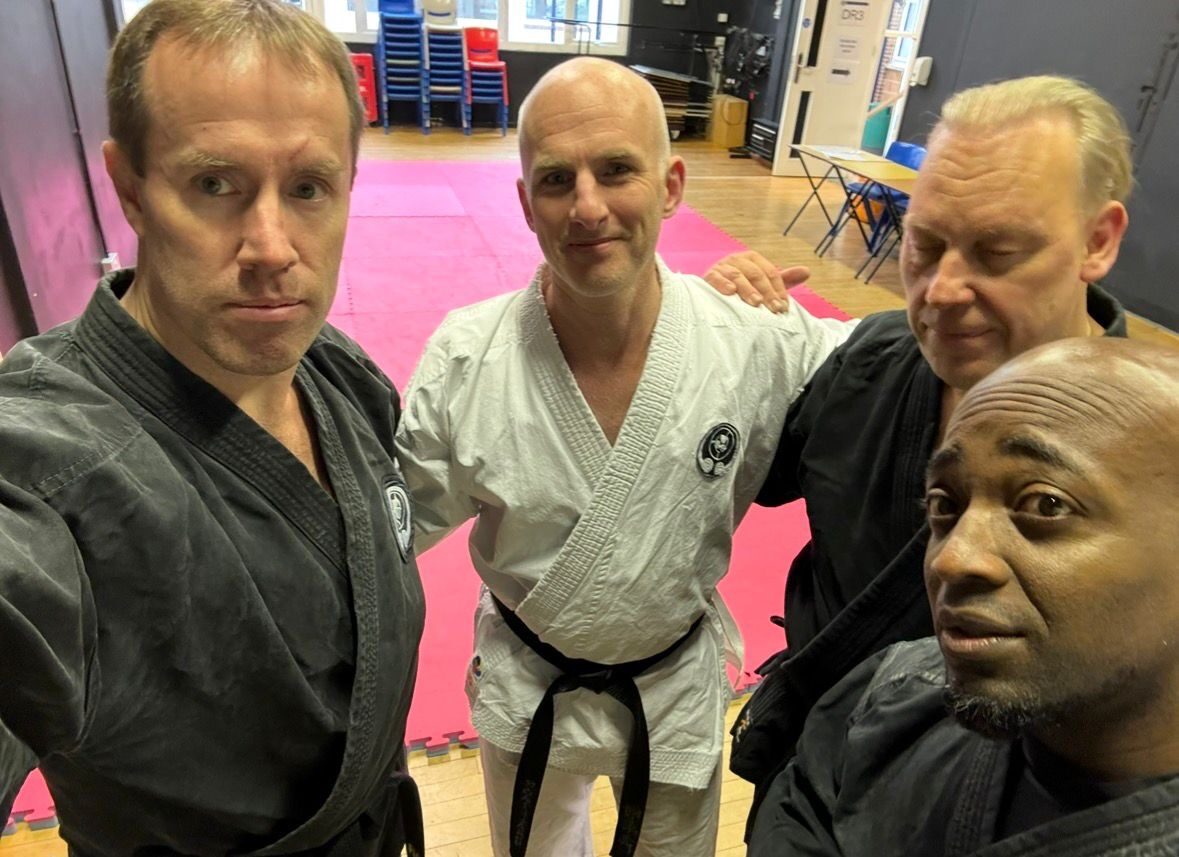Mike Thornton with three fellow black belts