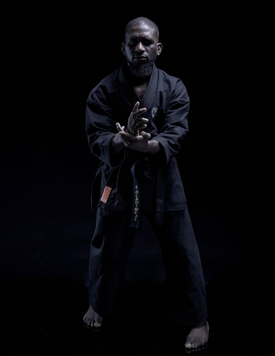Tunde Oladimeji - black dogi studio portrait